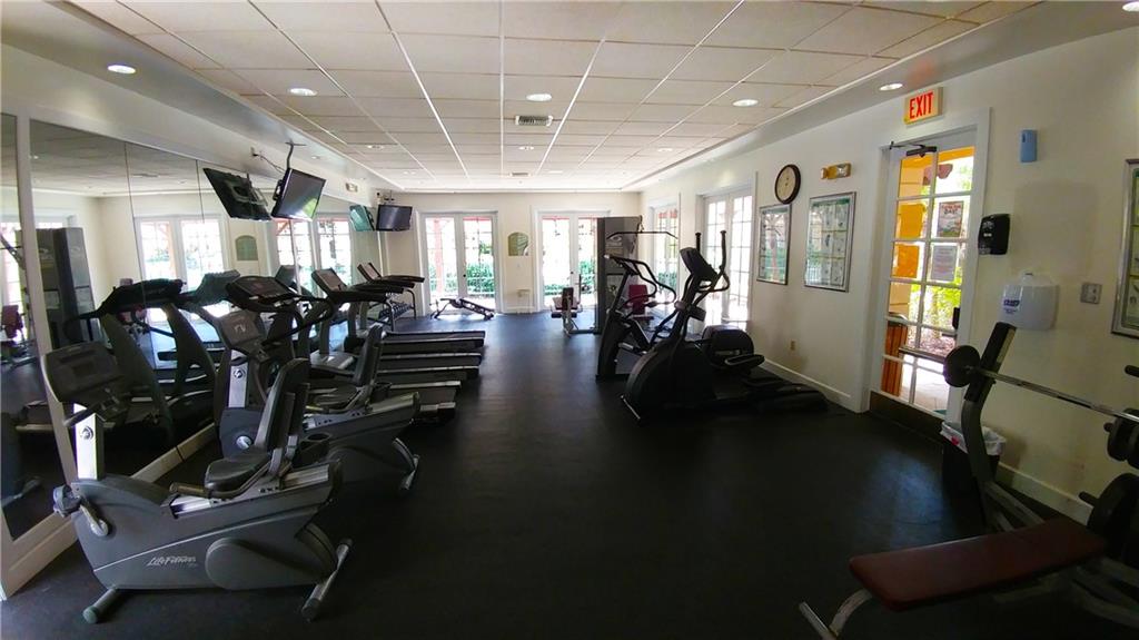 6640 West Sample Road, Unit 6640 Coral Springs, FL 33067 - Photo 23 of 25 a view of a room with gym equipment