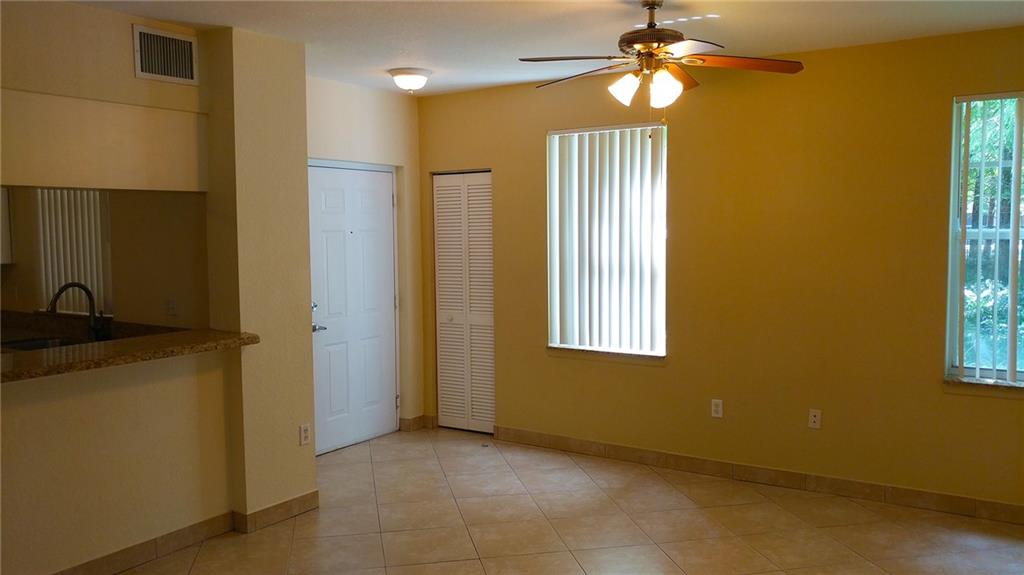 6640 West Sample Road, Unit 6640 Coral Springs, FL 33067 - Photo 3 of 25 a view of a room with a chandelier