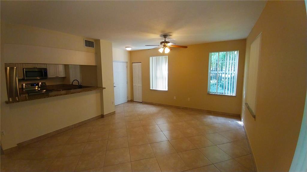 6640 West Sample Road, Unit 6640 Coral Springs, FL 33067 - Photo 4 of 25 a view of a kitchen cabinets and a kitchen