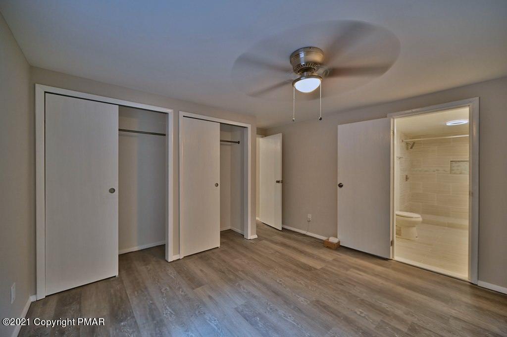 102 Forest Road Dingmans Ferry, PA 18328 - Photo 27 of 75 wooden floor in an empty room with a window