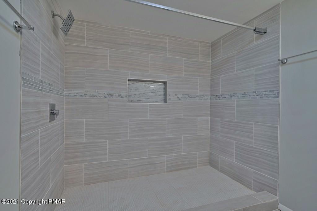 102 Forest Road Dingmans Ferry, PA 18328 - Photo 31 of 75 a bathroom with a shower