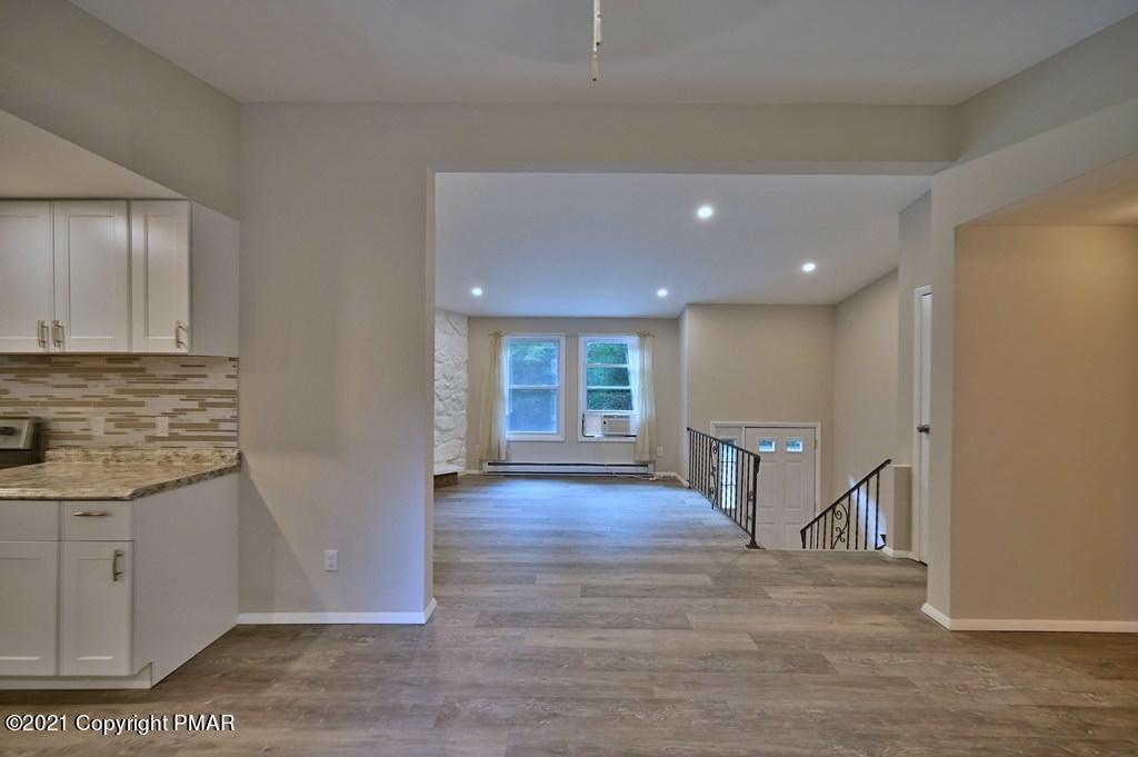 102 Forest Road Dingmans Ferry, PA 18328 - Photo 36 of 75 a view of empty room with wooden floor and fan