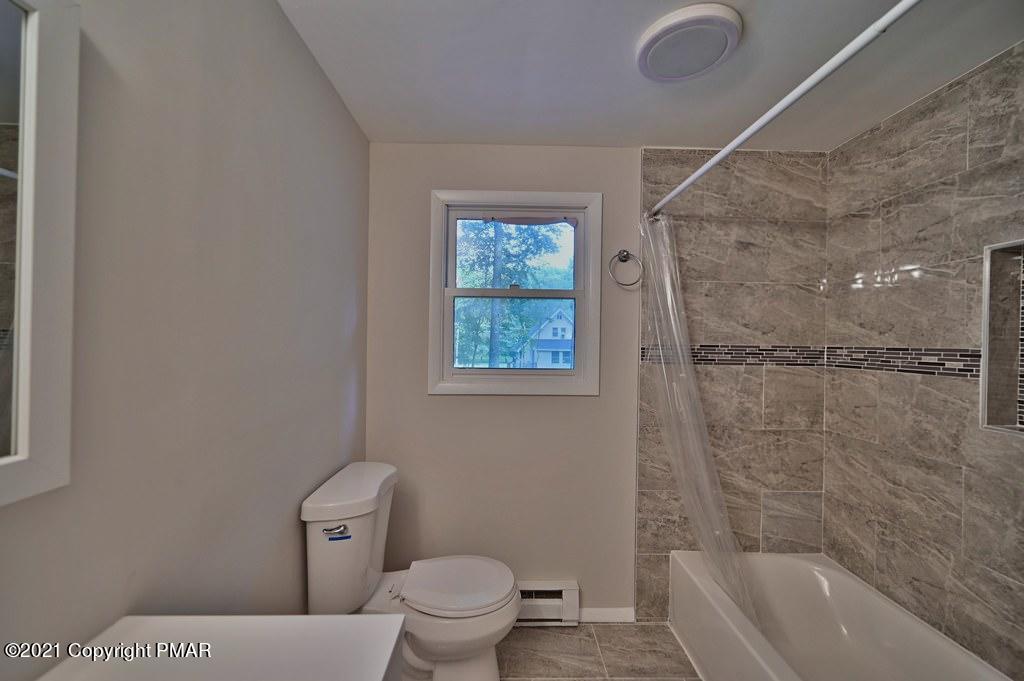 102 Forest Road Dingmans Ferry, PA 18328 - Photo 40 of 75 a bathroom with a toilet sink and shower