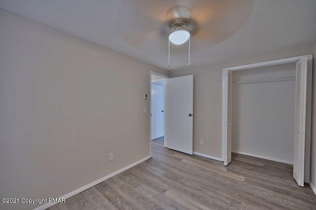 102 Forest Road Dingmans Ferry, PA 18328 - Photo 46 of 75 a view of an empty room and wooden floor