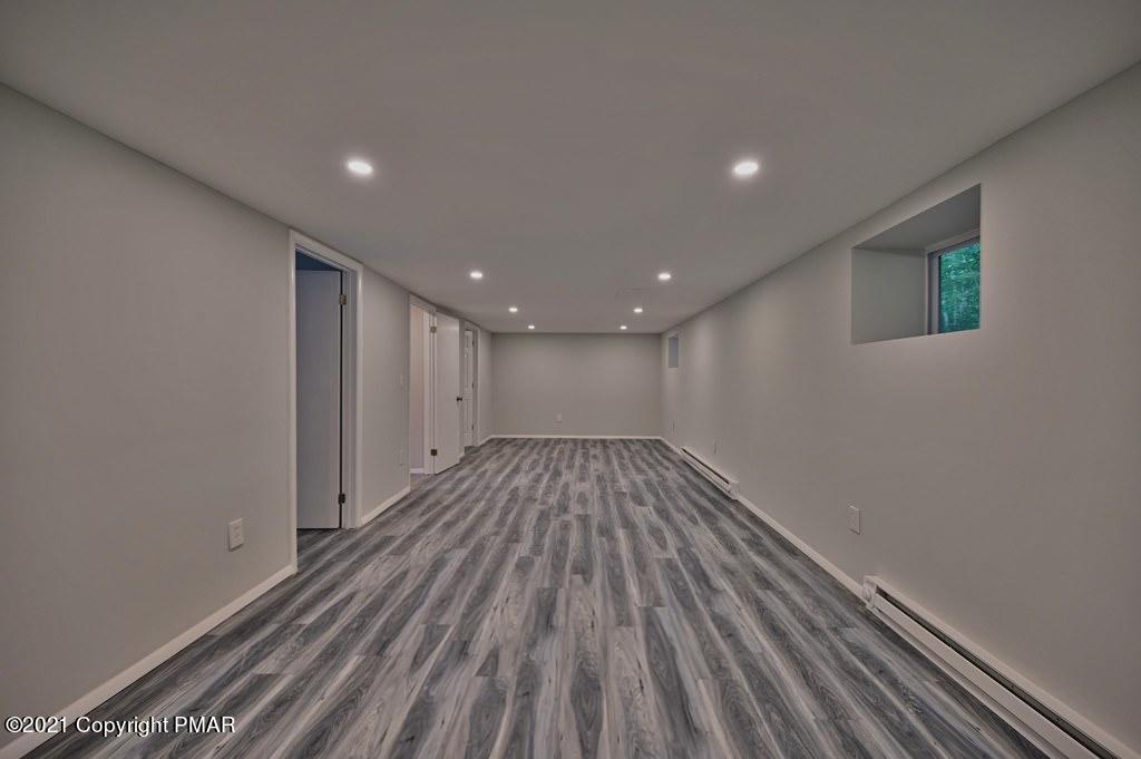 102 Forest Road Dingmans Ferry, PA 18328 - Photo 49 of 75 a view of hallway with wooden floor