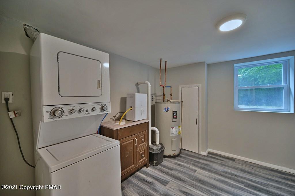 102 Forest Road Dingmans Ferry, PA 18328 - Photo 54 of 75 a view of a storage & utility room with washer and dryer