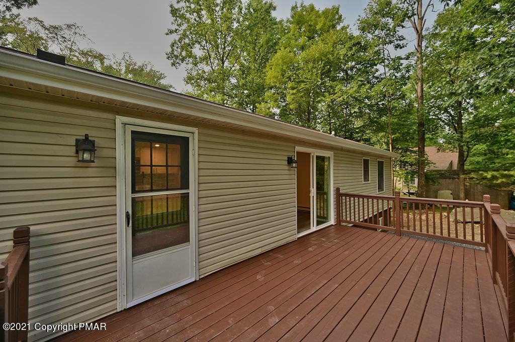 102 Forest Road Dingmans Ferry, PA 18328 - Photo 62 of 75 a view of a house with a deck