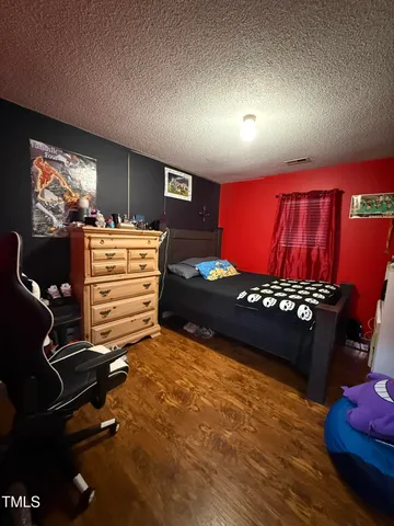 a room with furniture and a flat screen tv