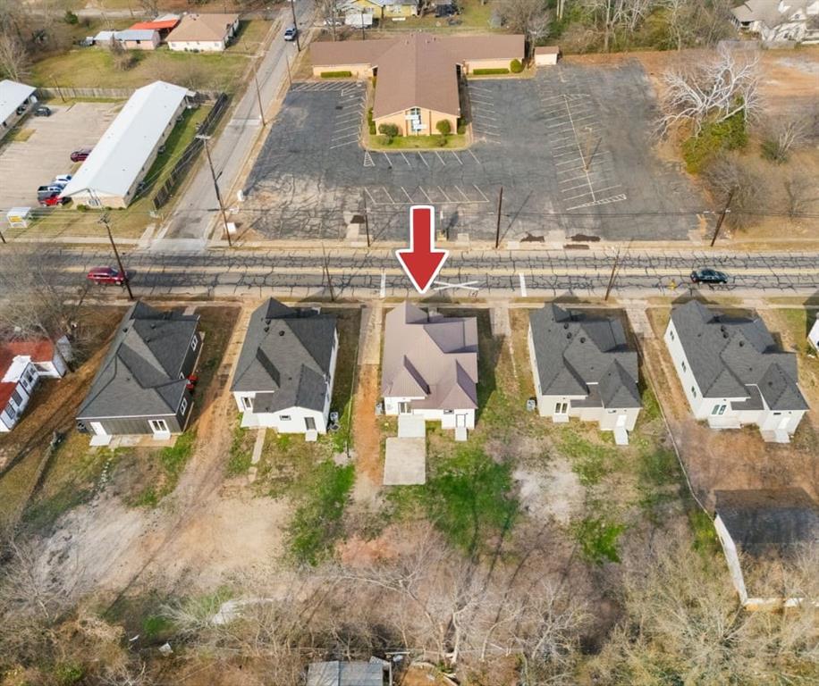 1259 Bonham Street Paris, TX 75460 - Photo 18 of 18 an aerial view of residential houses with outdoor space