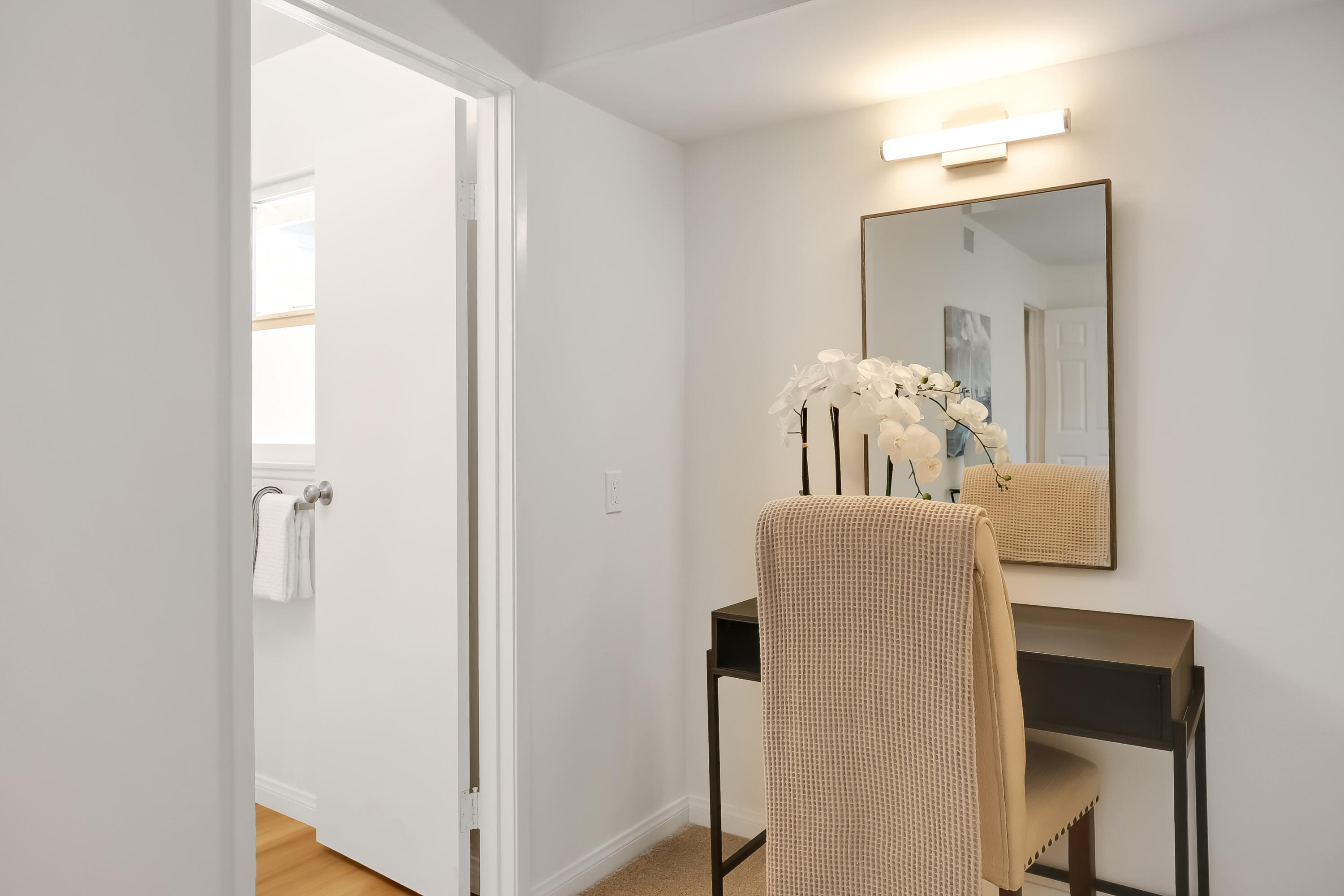 249 Placer Drive Santa Barbara, CA 93117 - Photo 13 of 33 a room with a mirror and a wooden floor