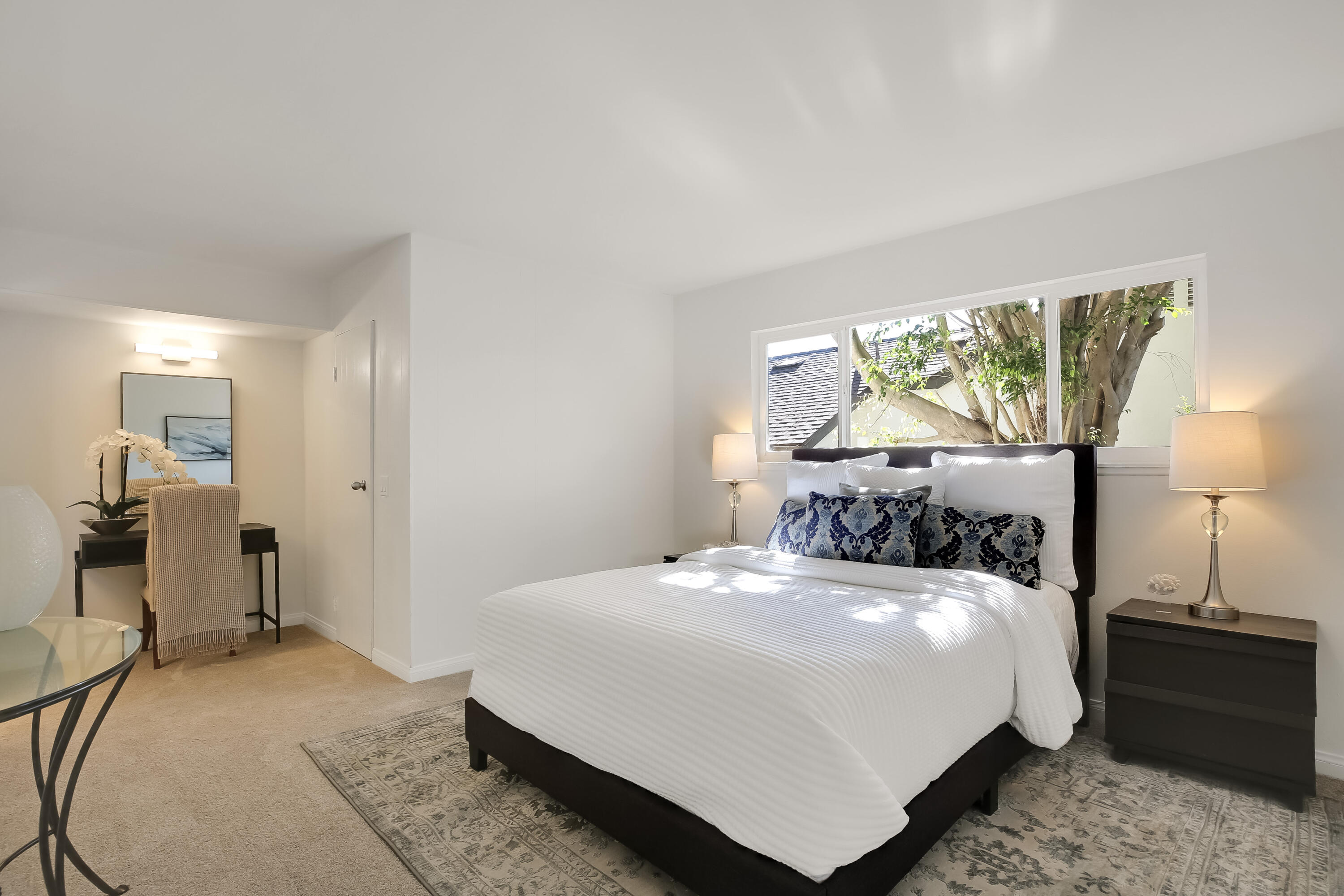 249 Placer Drive Santa Barbara, CA 93117 - Photo 14 of 33 a bedroom with a bed and a large window