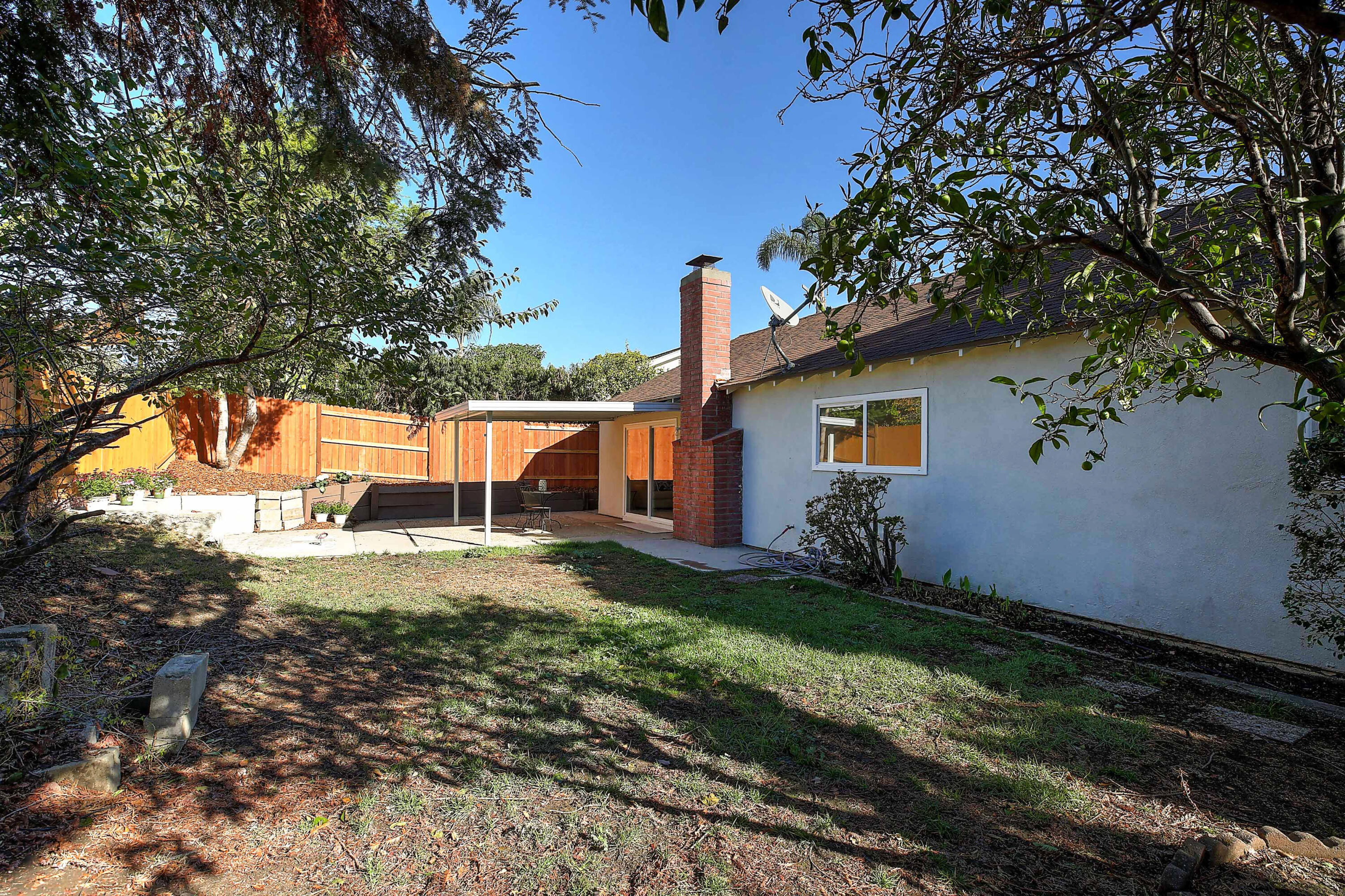 249 Placer Drive Santa Barbara, CA 93117 - Photo 20 of 33 a view of a backyard with large trees