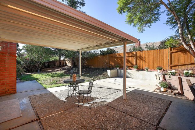 a living room with patio furniture