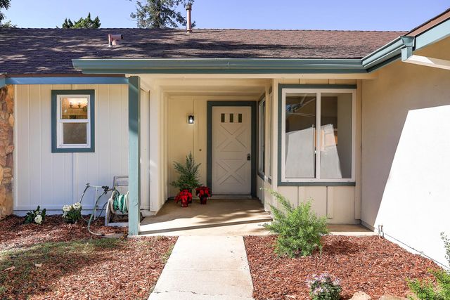 a view of a patio with table and chairs a barbeque with wooden fence and floor