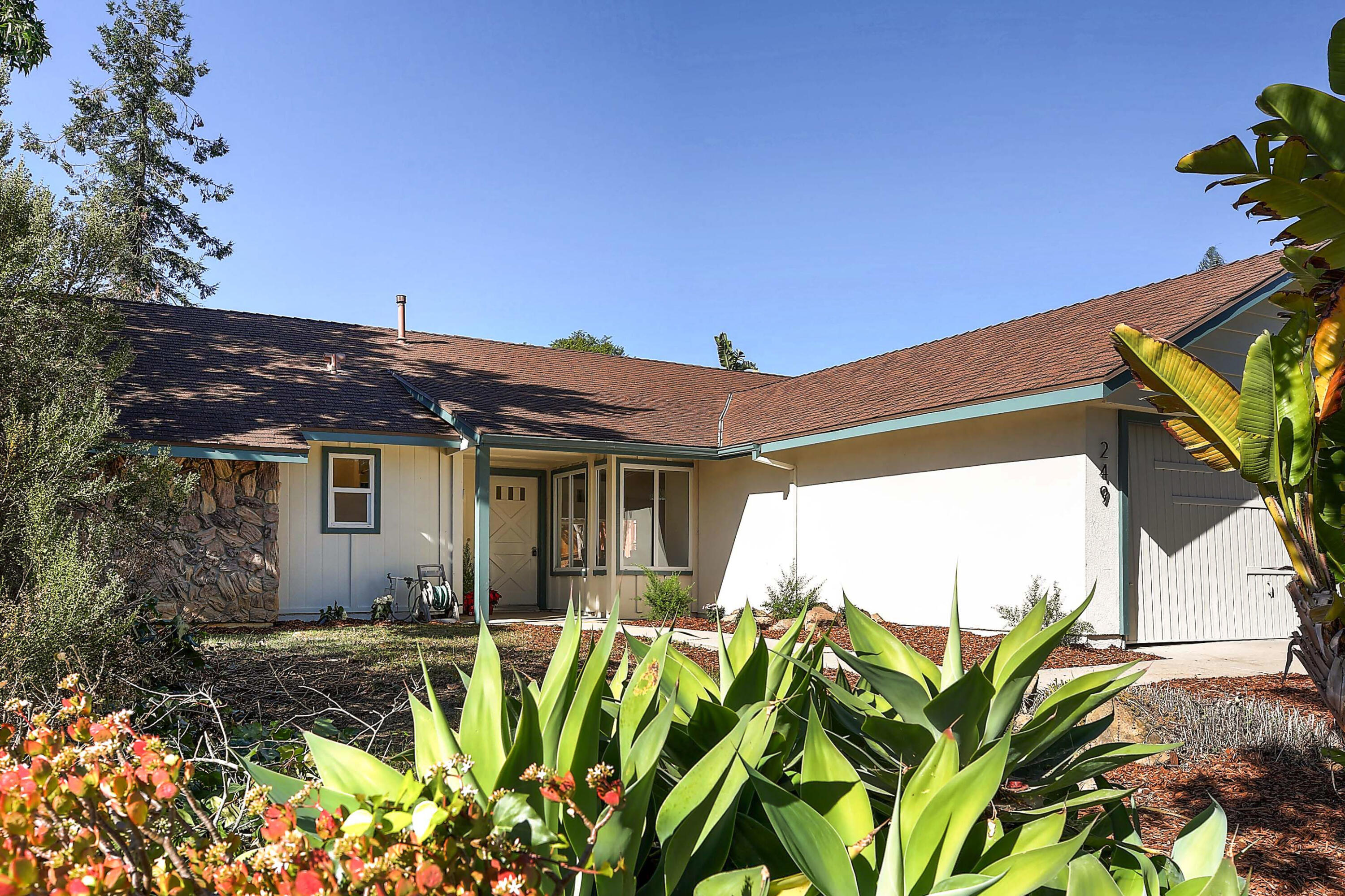 249 Placer Drive Santa Barbara, CA 93117 - Photo 30 of 33 a view of a house with a flower garden