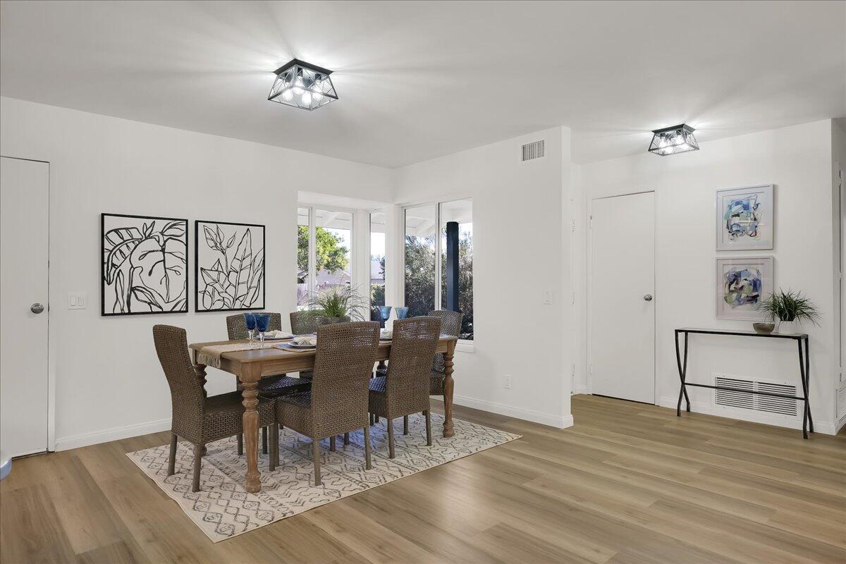 249 Placer Drive Santa Barbara, CA 93117 - Photo 10 of 33 a view of a dining room with furniture and wooden floor