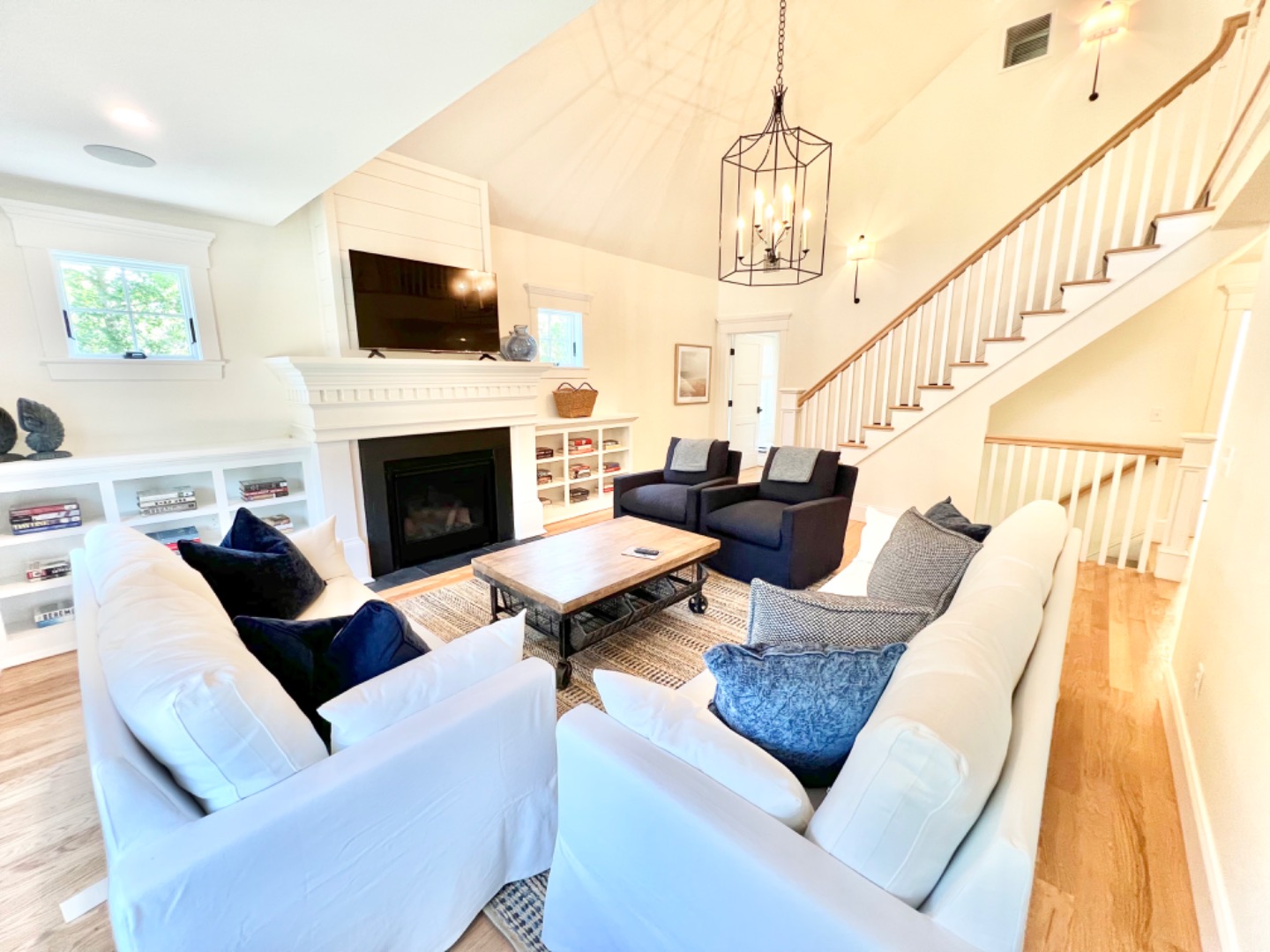 90 Marthas Road Edgartown, MA 02539 - Photo 54 of 137 a living room with furniture fireplace and a flat screen tv