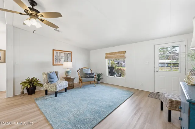 a room with furniture and wooden floor