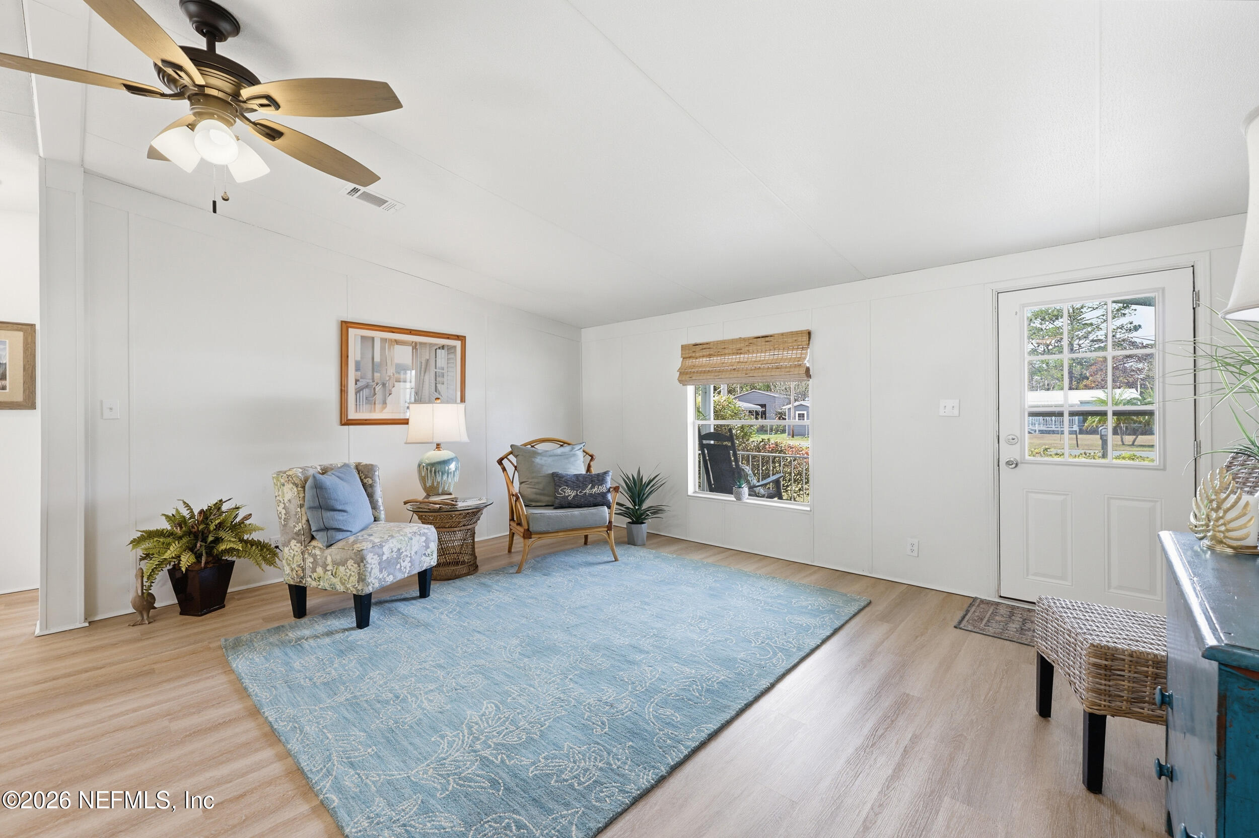 116 Waterside Avenue Satsuma, FL 32189 - Photo 11 of 53 a living room with furniture and wooden floor