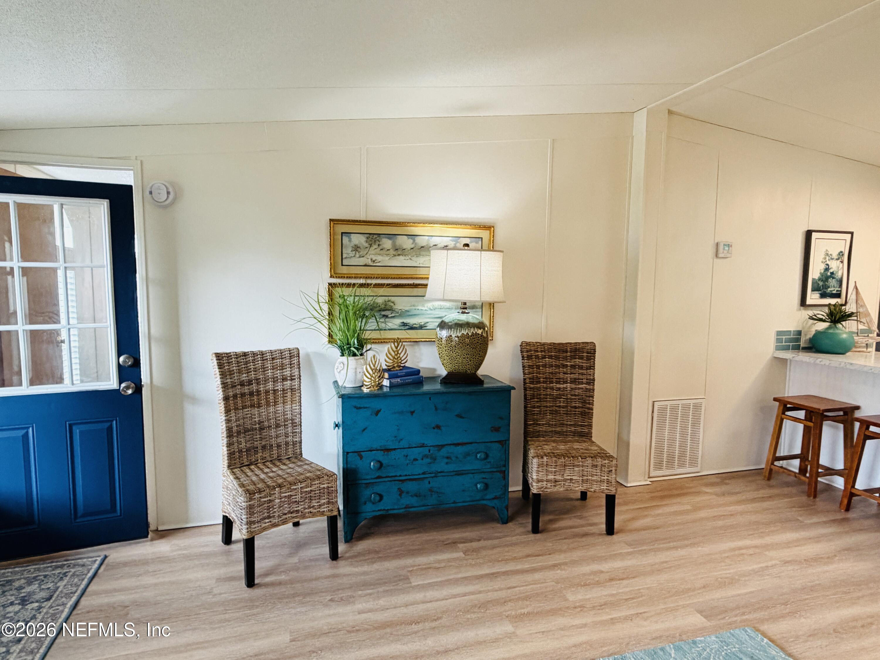 116 Waterside Avenue Satsuma, FL 32189 - Photo 12 of 53 a room with furniture and wooden floor