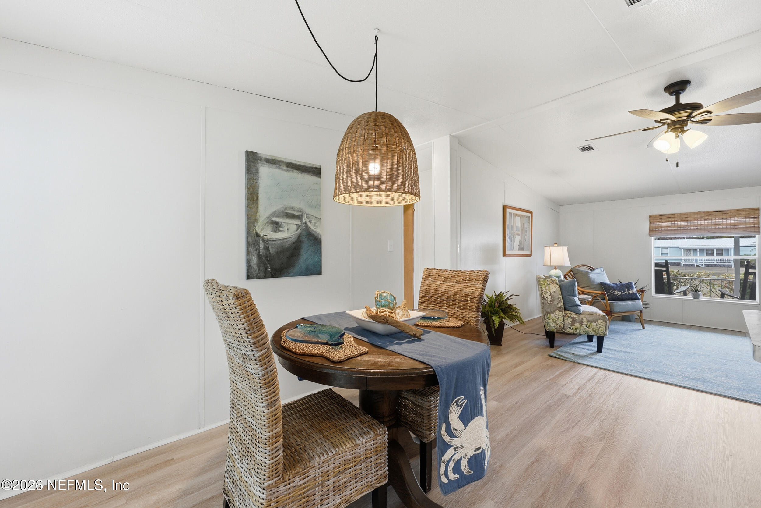 116 Waterside Avenue Satsuma, FL 32189 - Photo 18 of 53 a living room with furniture a table and wooden floor