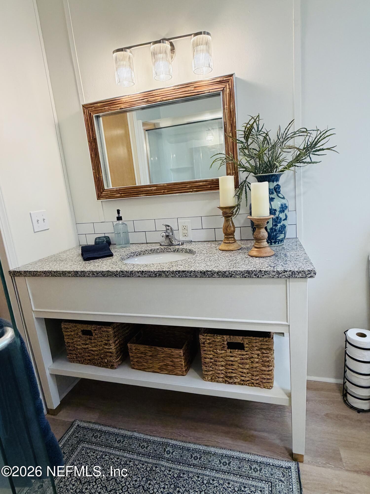 116 Waterside Avenue Satsuma, FL 32189 - Photo 23 of 53 a bathroom with a sink and a mirror