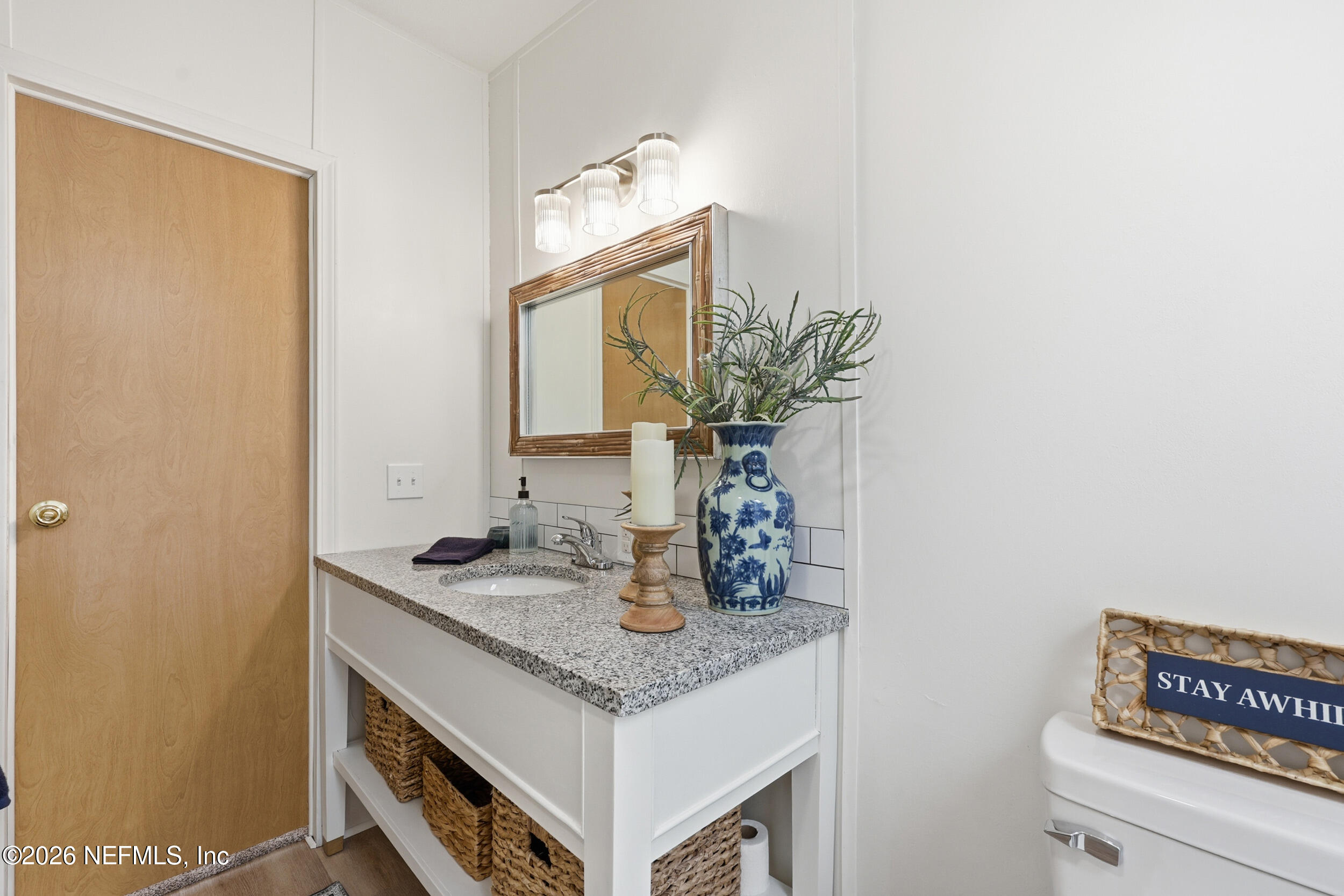 116 Waterside Avenue Satsuma, FL 32189 - Photo 25 of 53 a bathroom with a sink and a mirror