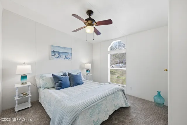 a bathroom with a sink a toilet and shower curtain