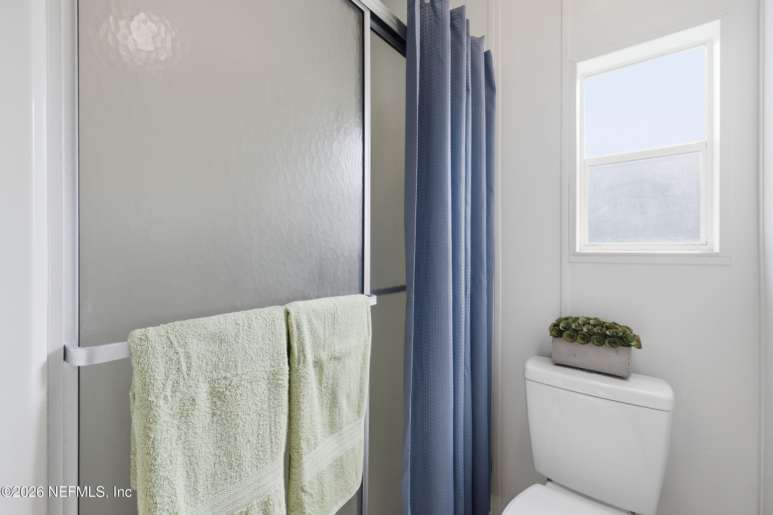 116 Waterside Avenue Satsuma, FL 32189 - Photo 32 of 53 a bathroom with a toilet and a shower