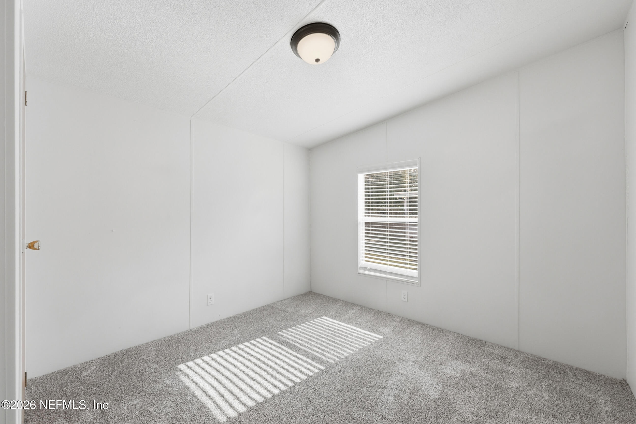 116 Waterside Avenue Satsuma, FL 32189 - Photo 33 of 53 a view of an empty room with a window