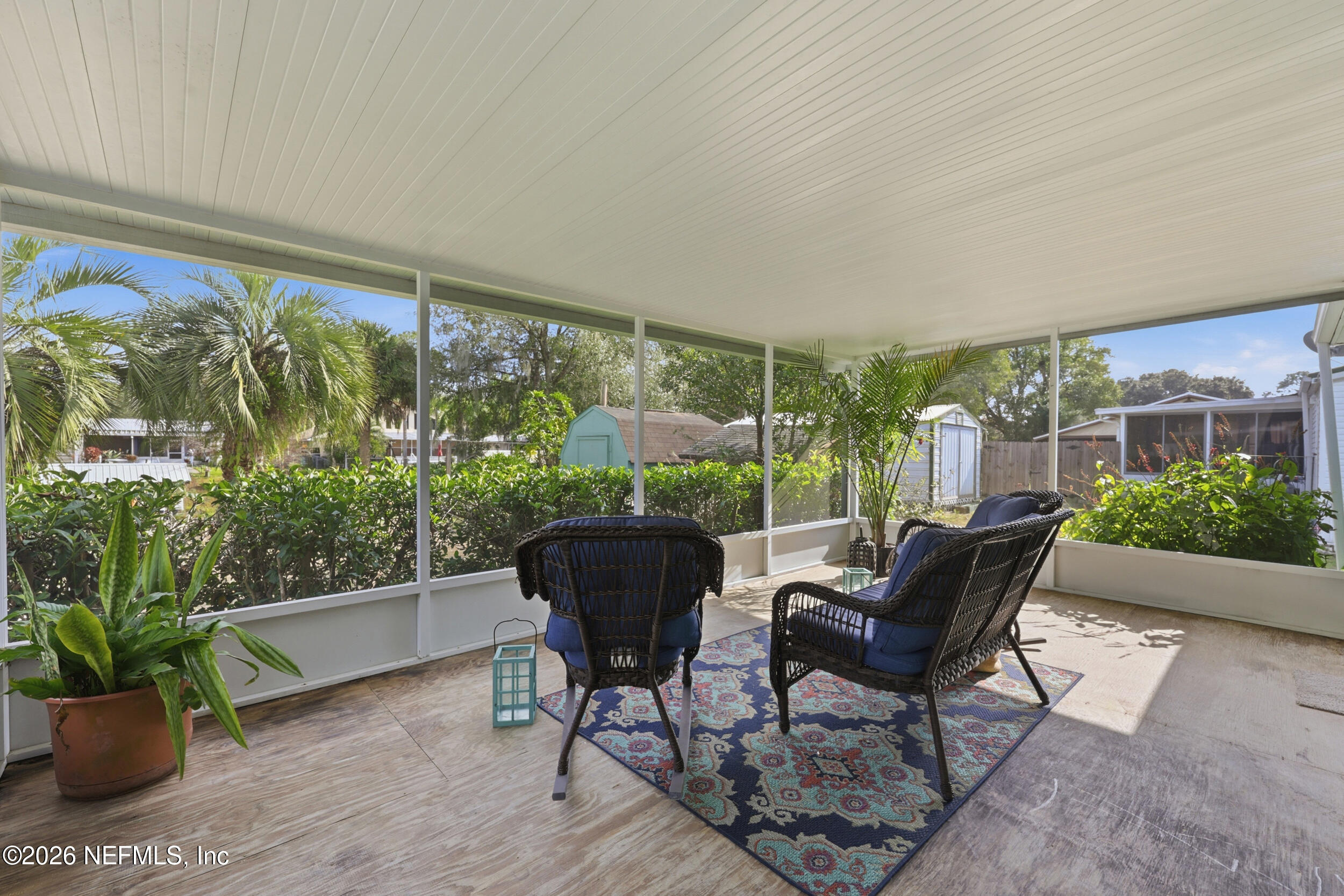 116 Waterside Avenue Satsuma, FL 32189 - Photo 37 of 53 a living room with furniture and a potted plant