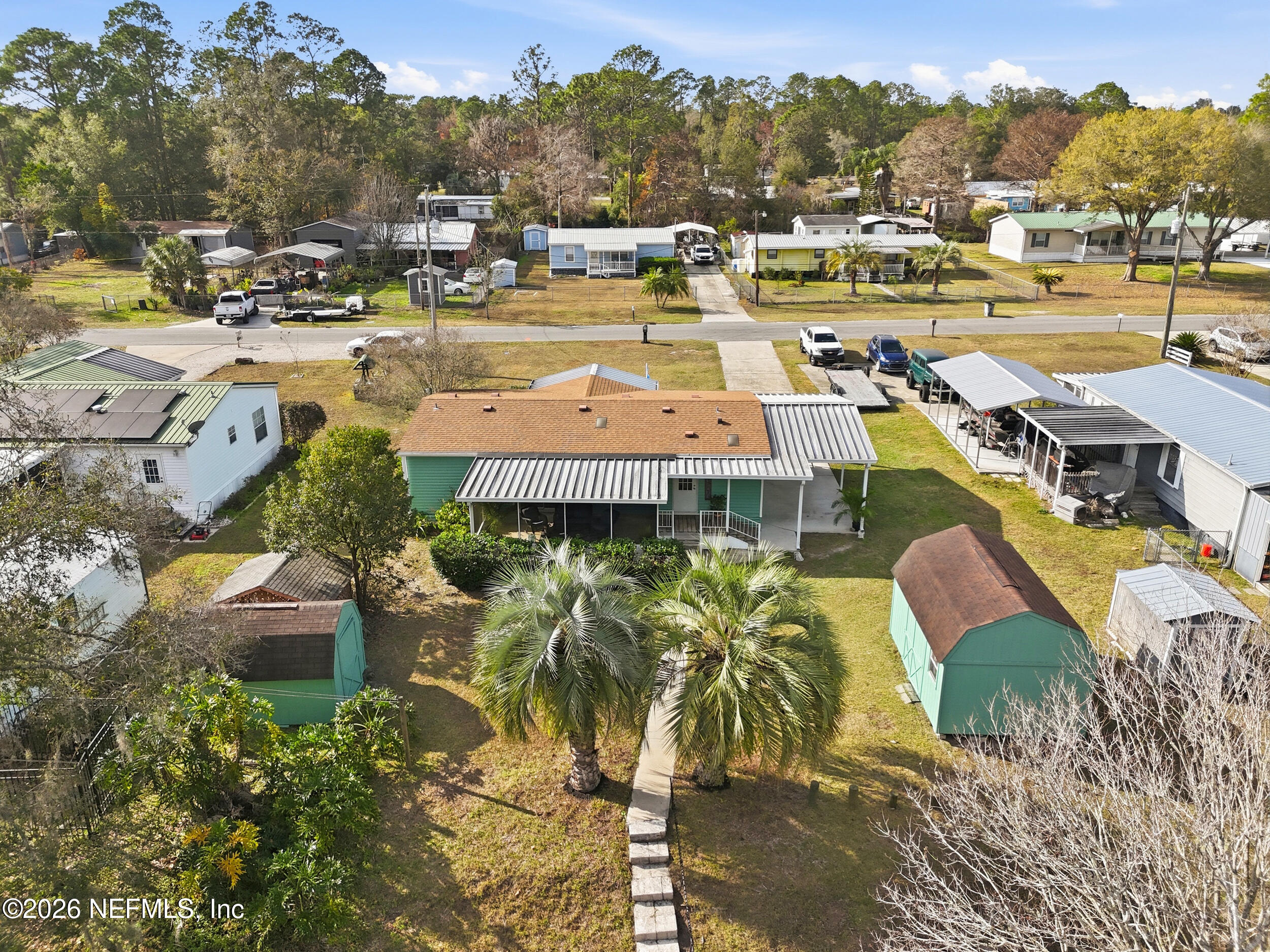 116 Waterside Avenue Satsuma, FL 32189 - Photo 45 of 53 a picture of a city with lots of residential buildings ocean and mountain view in back