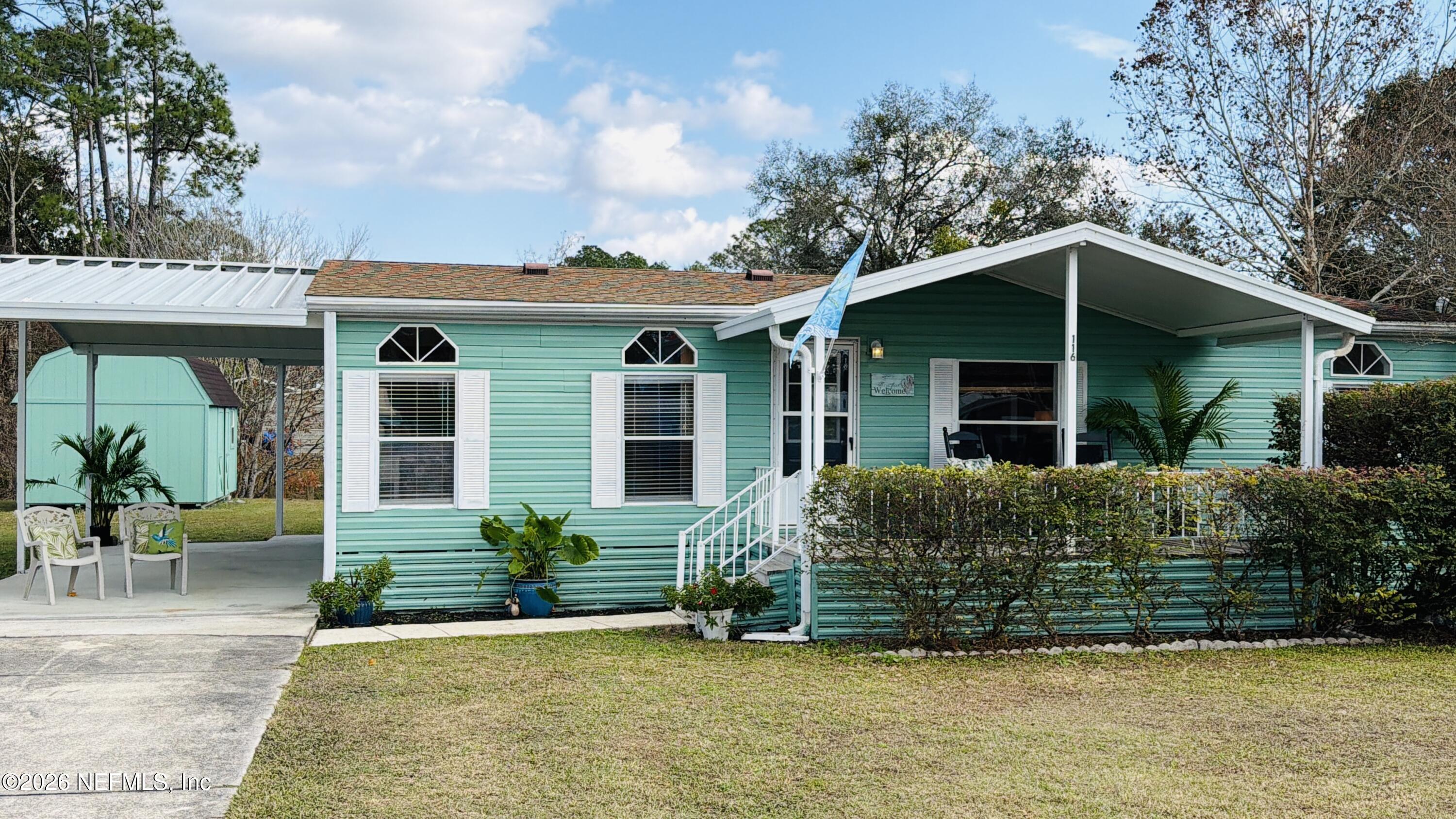 116 Waterside Avenue Satsuma, FL 32189 - Photo 49 of 53 a view of a house with a yard and plants