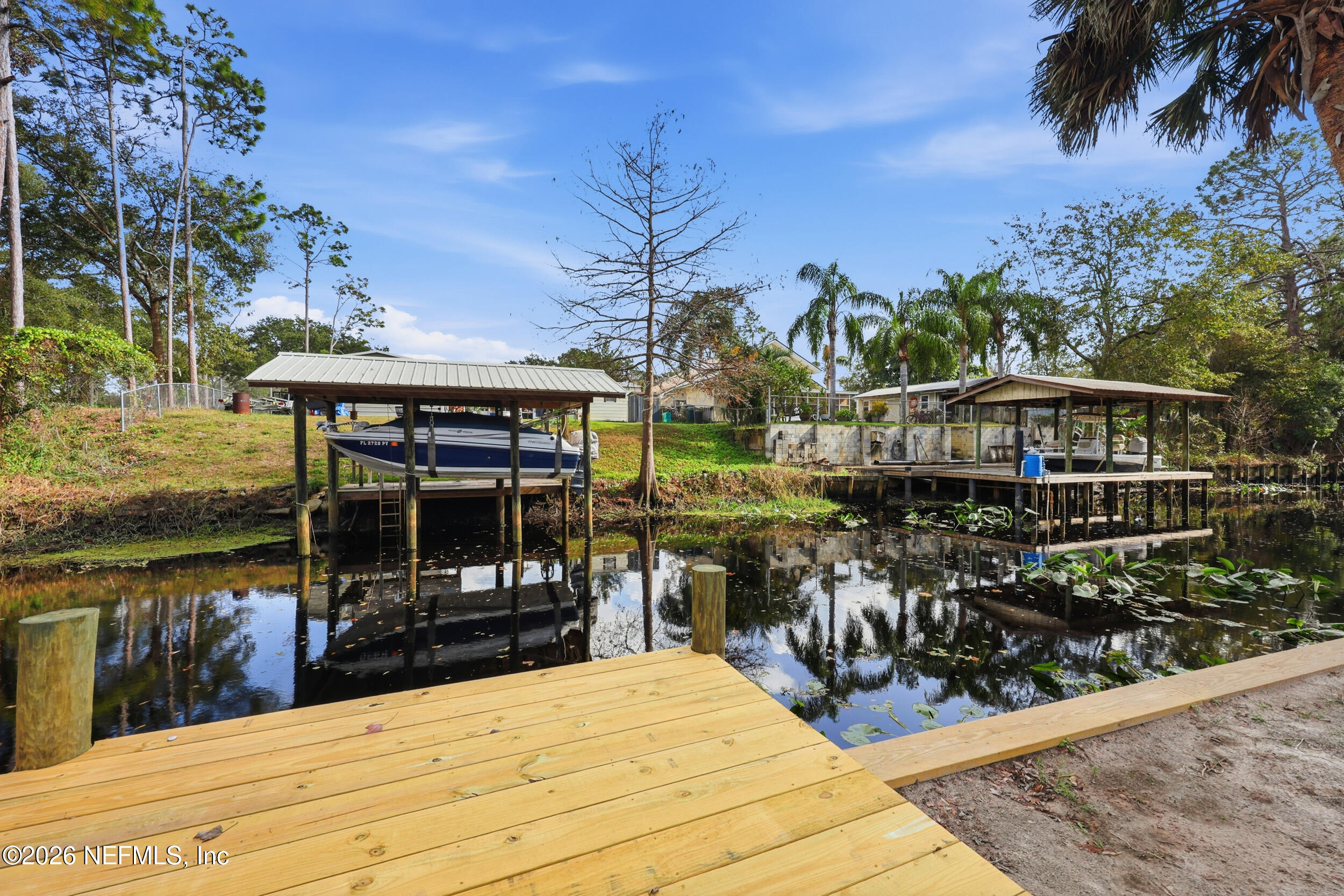 116 Waterside Avenue Satsuma, FL 32189 - Photo 5 of 53 a view of a chairs and table in the patio