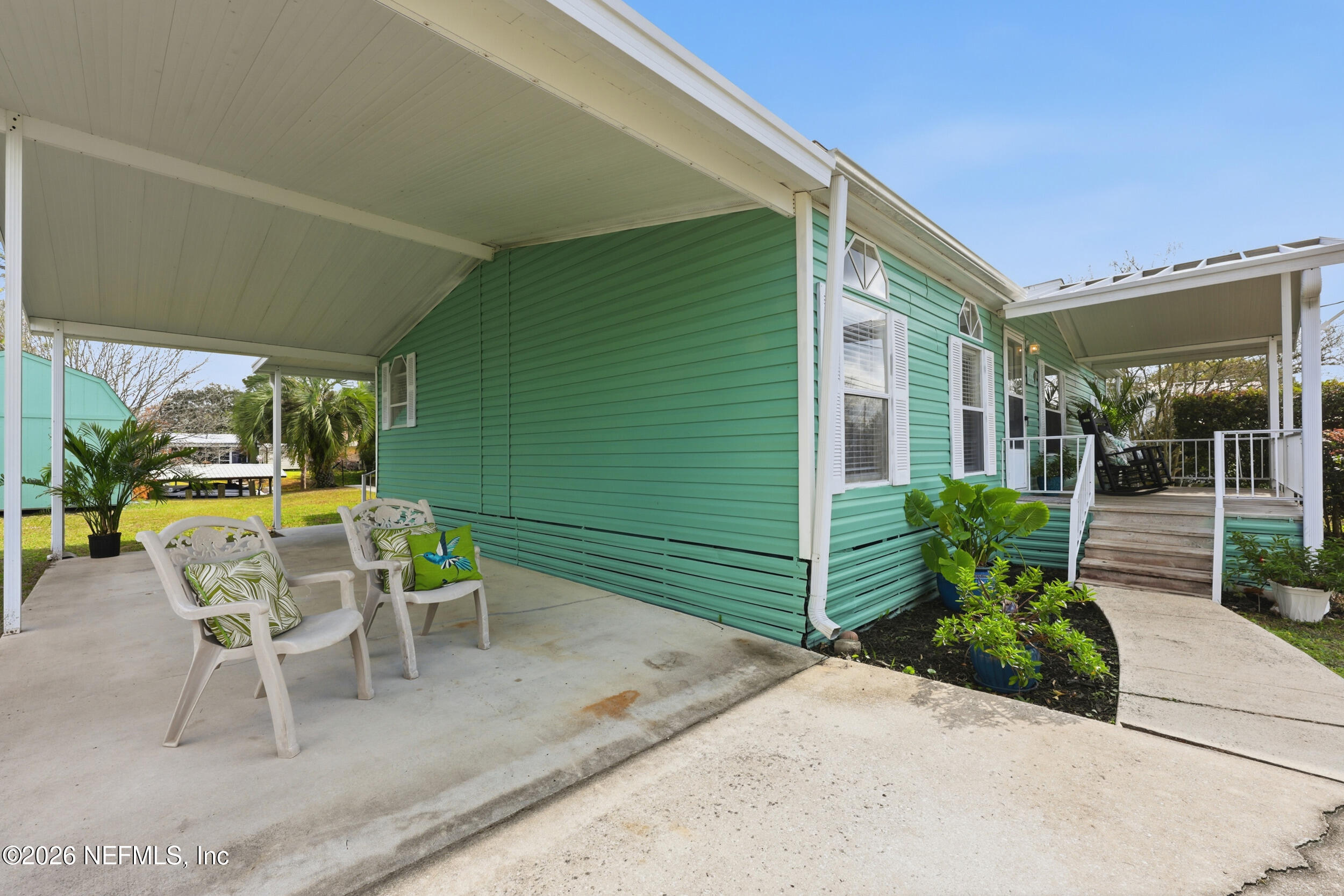 116 Waterside Avenue Satsuma, FL 32189 - Photo 53 of 53 a view of a chair and tables in the patio