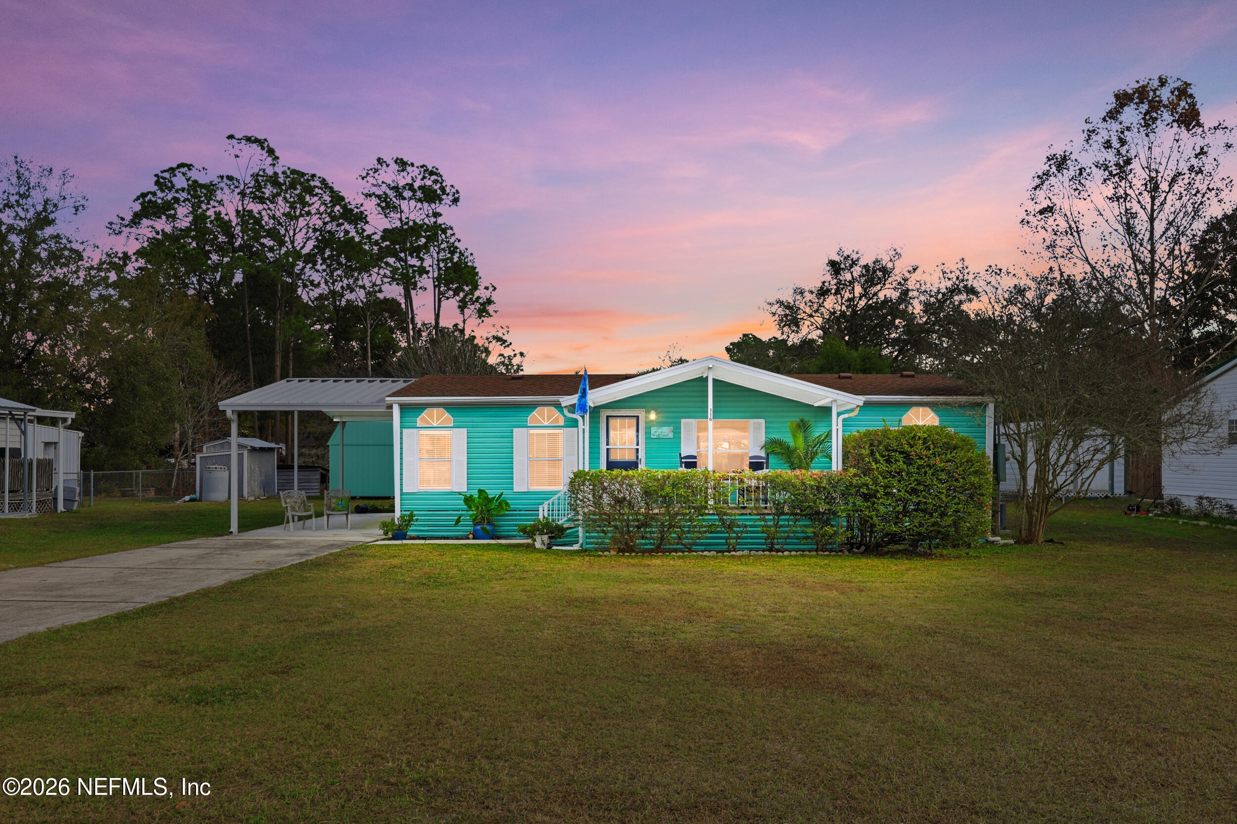 116 Waterside Avenue Satsuma, FL 32189 - Photo 9 of 53 a front view of a house with a garden