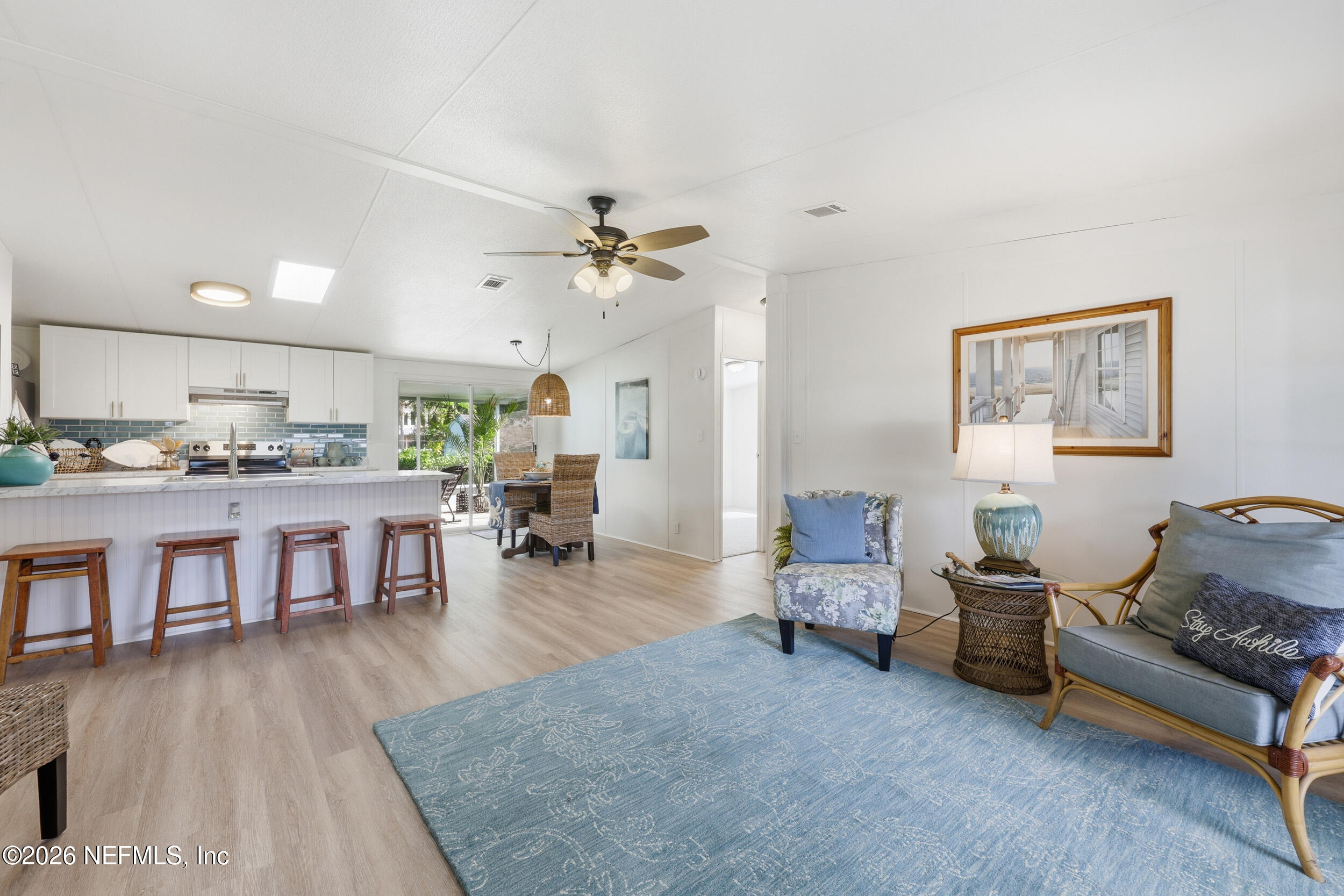 116 Waterside Avenue Satsuma, FL 32189 - Photo 10 of 53 a living room with furniture and kitchen view
