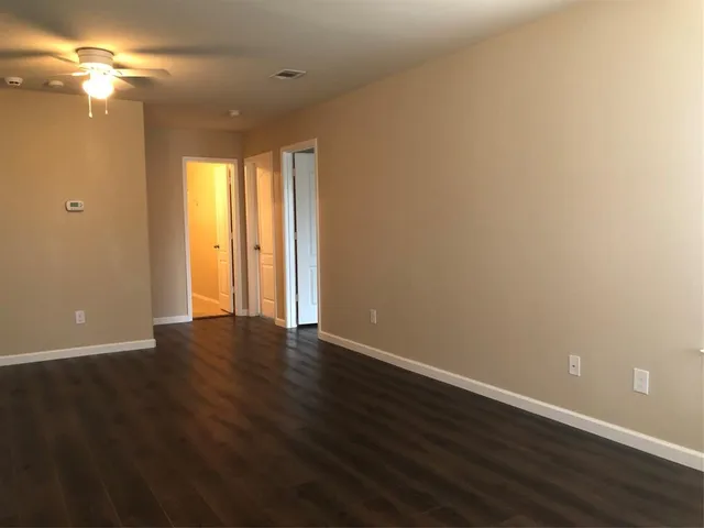 a view of room with window and hardwood floor