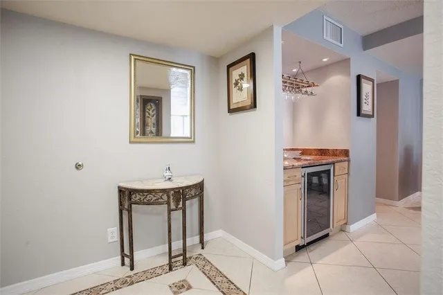 a kitchen with stainless steel appliances granite countertop a refrigerator and a stove