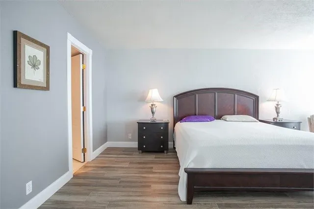 a bedroom with a bed and a dresser