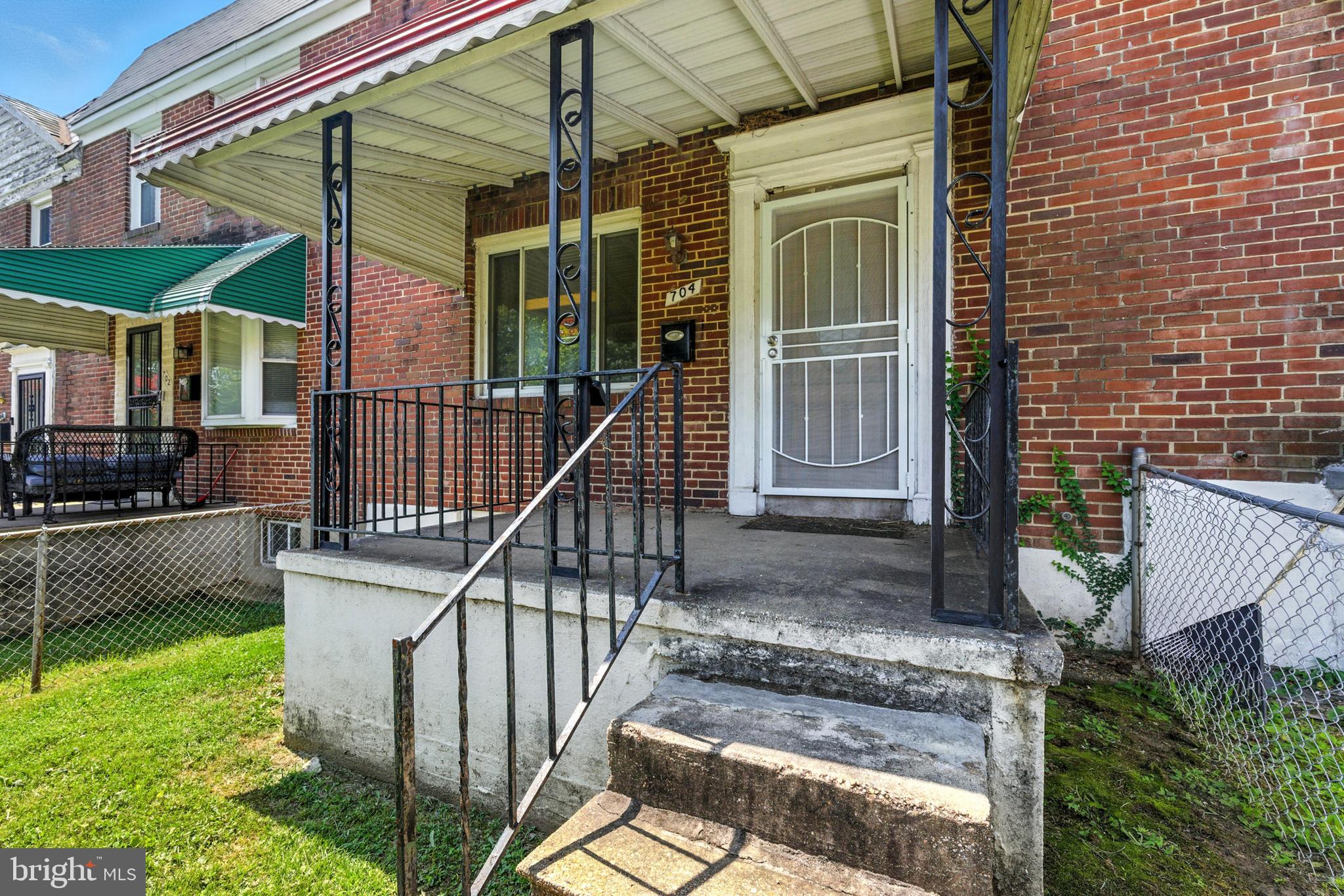 704 Wicklow Road Baltimore, MD 21229 - Photo 2 of 12 a view of house with a swimming pool