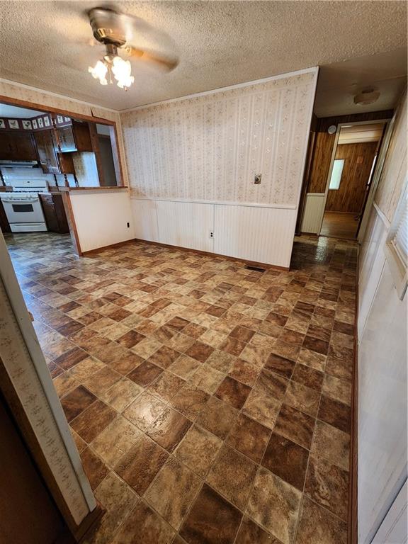 4706 Iowa Street Waco, TX 76705 - Photo 12 of 21 a view of an empty room with kitchen and a window