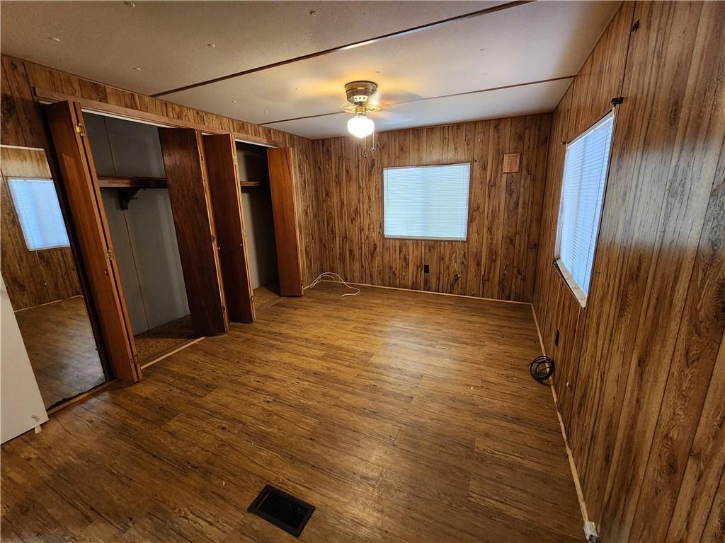 4706 Iowa Street Waco, TX 76705 - Photo 14 of 21 a view of empty room with wooden floor and fan