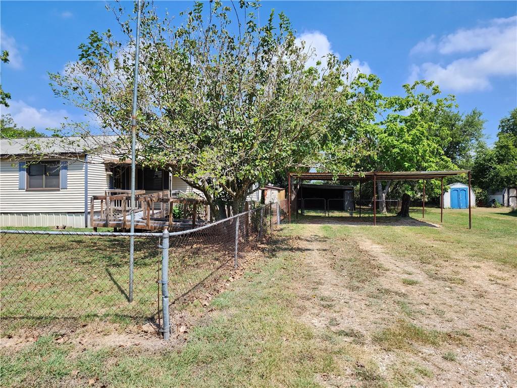 4706 Iowa Street Waco, TX 76705 - Photo 4 of 21 a view of a yard with wooden fence