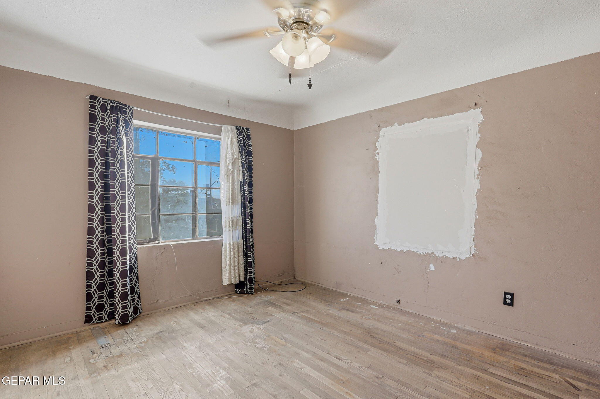 116 Tamarisk Street Anthony, TX 79821 - Photo 11 of 36 a view of an empty room with a window