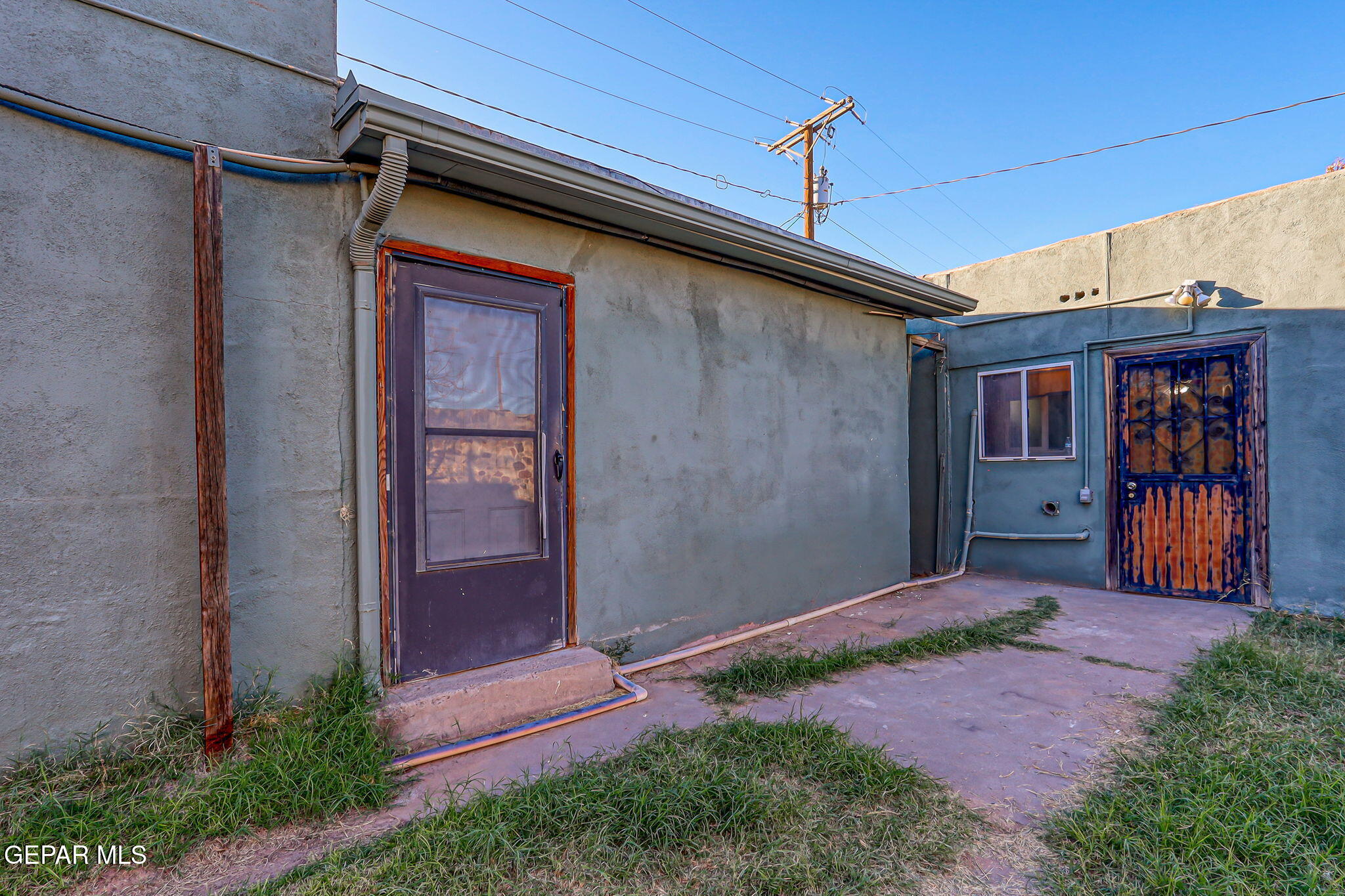 116 Tamarisk Street Anthony, TX 79821 - Photo 18 of 36 a backyard of a house with barbeque oven and seating space