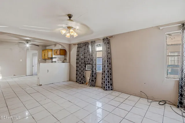 a view of a kitchen with a sink and cabinets