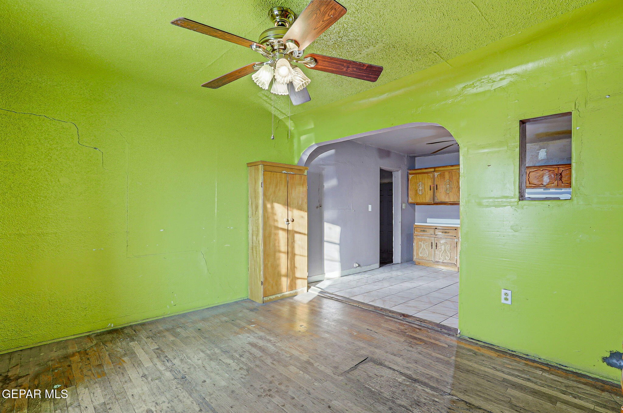 116 Tamarisk Street Anthony, TX 79821 - Photo 10 of 36 a view of a hallway with a chandelier fan and a large window