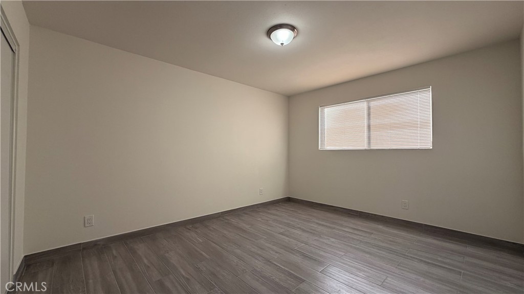 908 Marguerita Avenue, Unit 1 Alhambra, CA 91803 - Photo 6 of 11 an empty room with wooden floor and windows