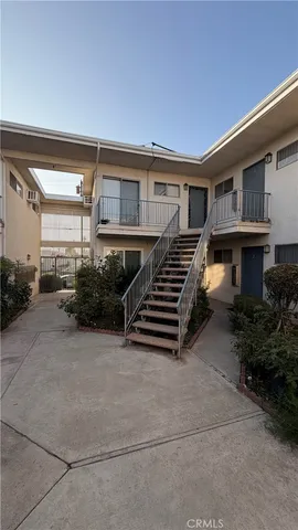 a view of a house with couches and deck